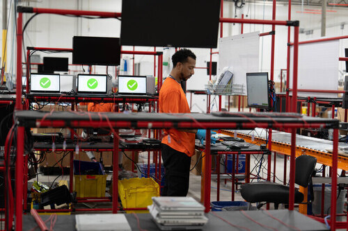 SK tes employee in US processing laptops for secure data destruction