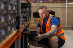 Operator scans corporate IT assets for reconciliation as part of ITAD process