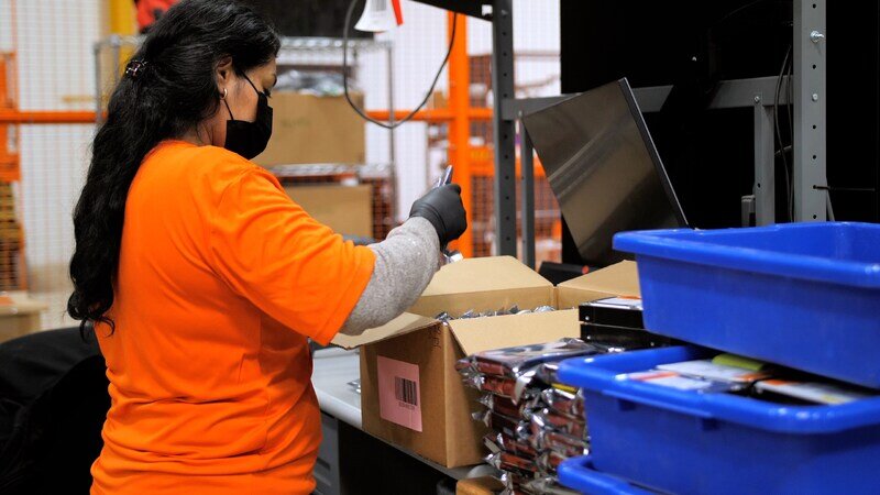 SK tes Employee packs hard drives for IT Asset Disposition
