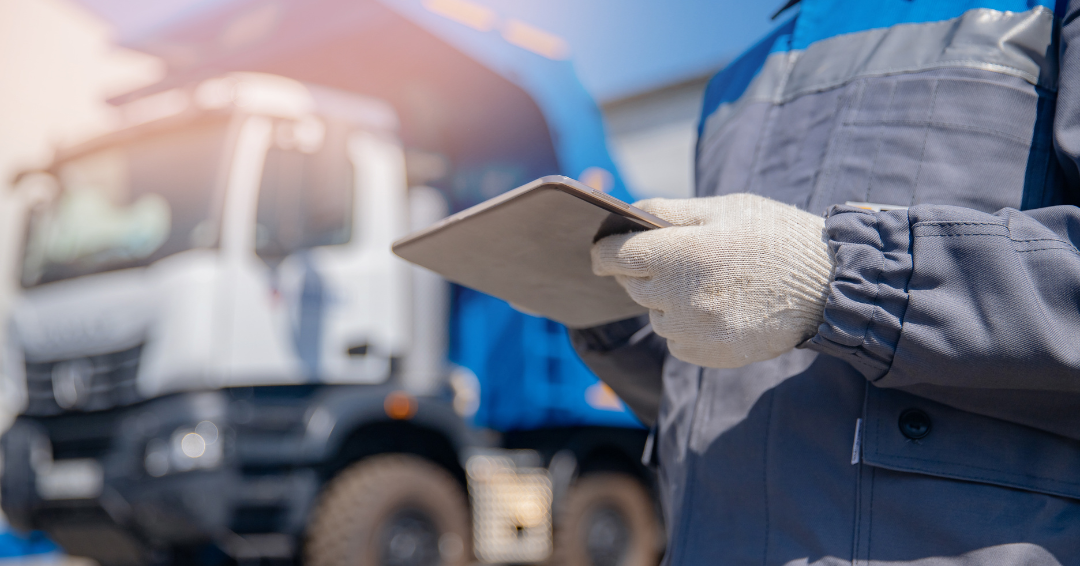 Truck operator with tablet computer controls loading of cargo